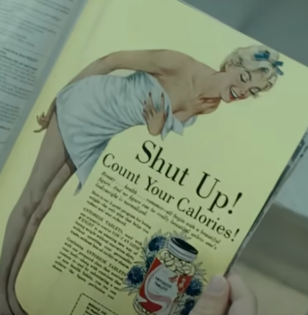 Beach Bunny still showing the lead singer holding a magazine that says “shut up, count your calories”